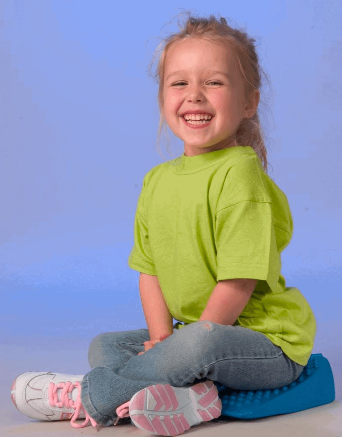 Kid Smiling While Seating In Move n Sit Wedge Junior