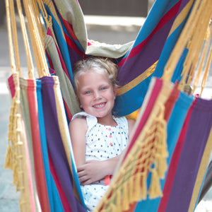 kid laying in the hammock chair tropical