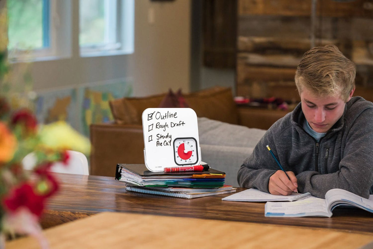 teenager studying while using time timer mod dry eraser board