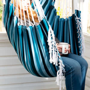 women seating in the hammock chair