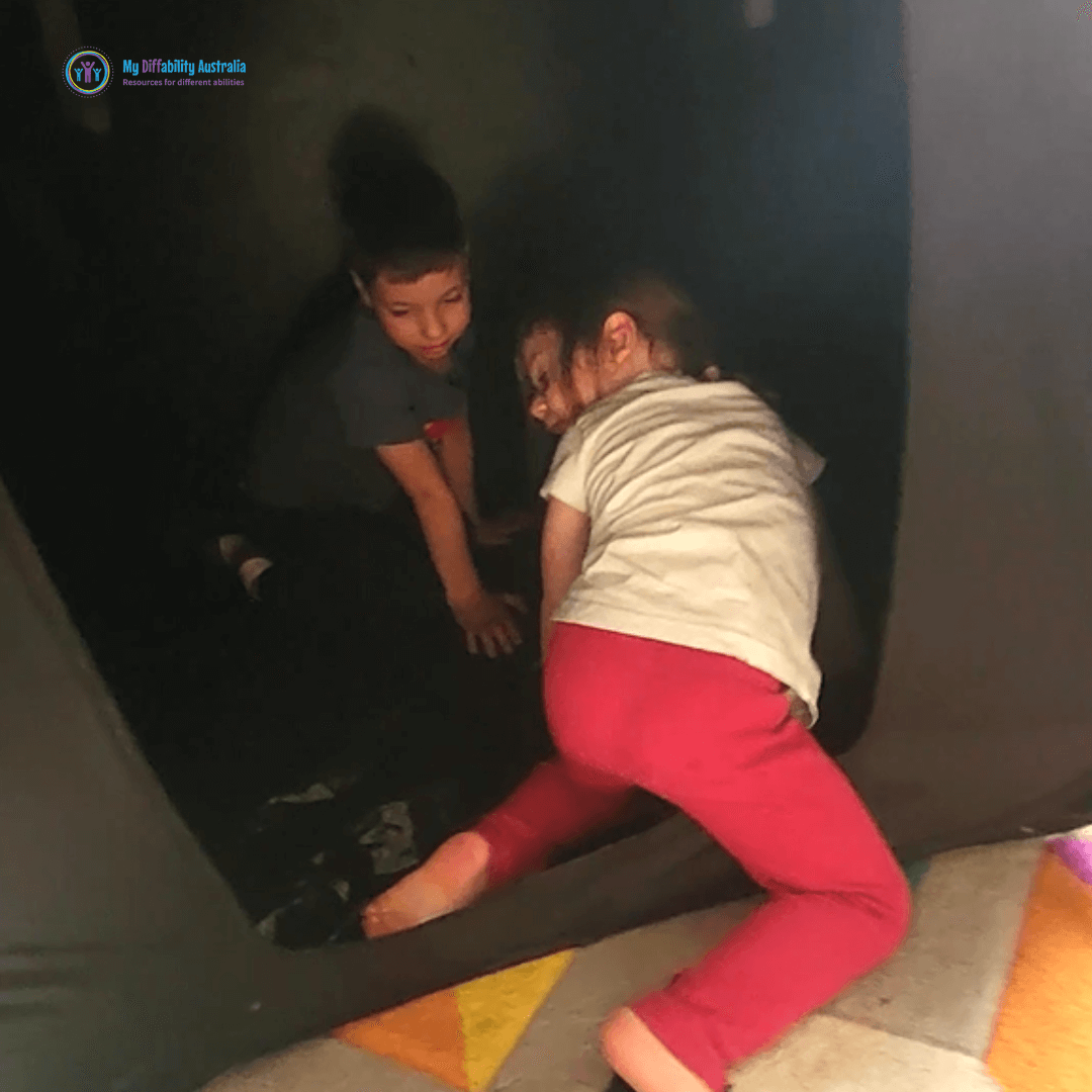 kids inside pop up dark den tent